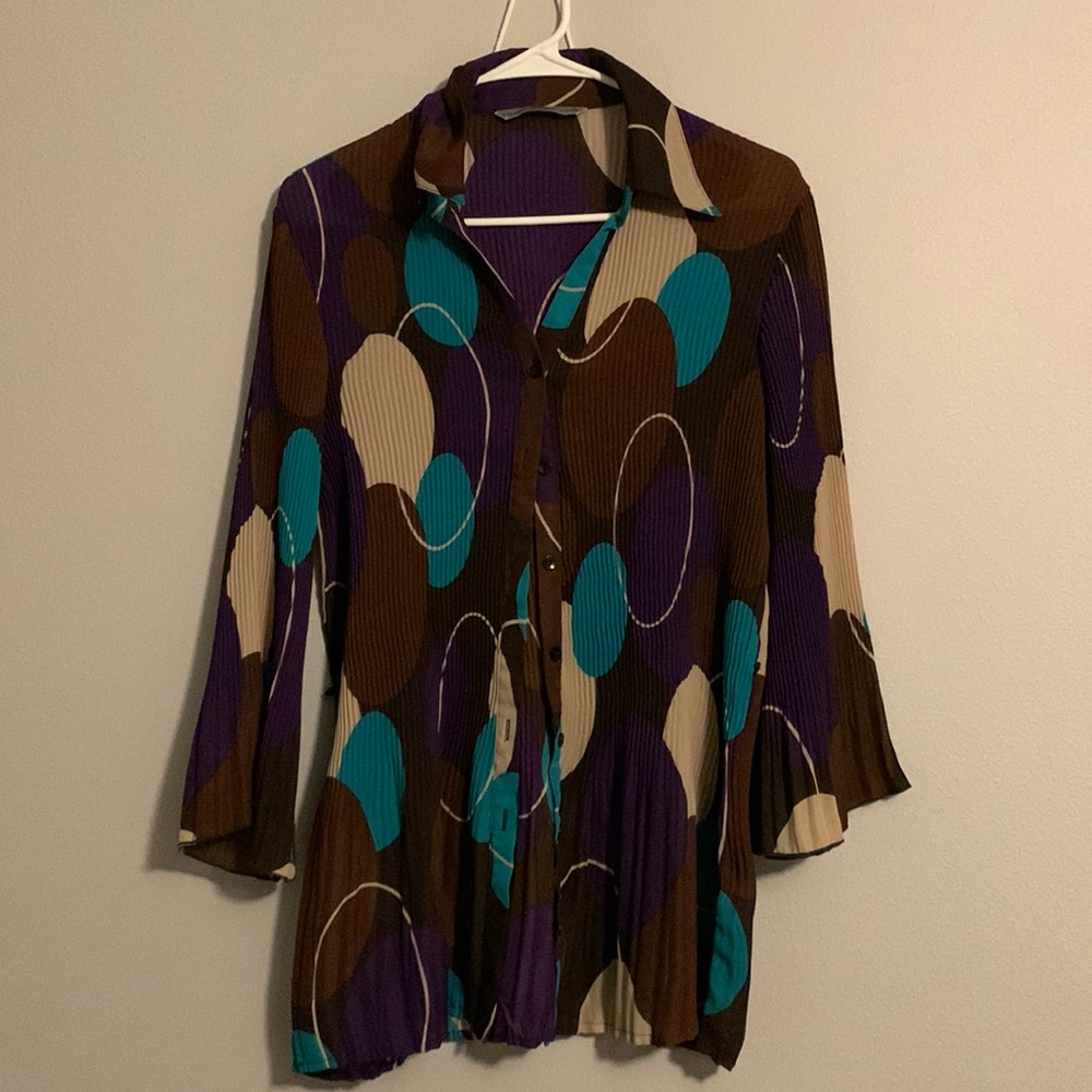 It’s a button up with bell sleeves